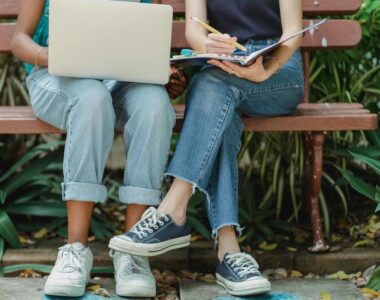 Two women on bench working casual livingonthepatio.com